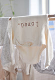 Loved organic long sleeve bodysuit by tenth & pine