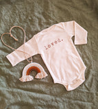 Loved organic long sleeve bodysuit by tenth & pine